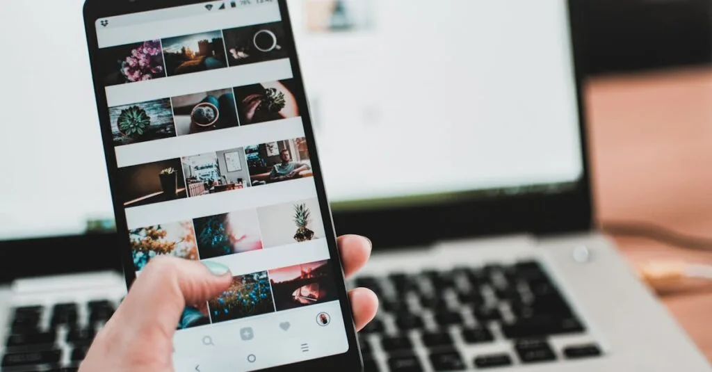 A person uses a smartphone to browse social media in front of a laptop, emphasizing modern technology and lifestyle.